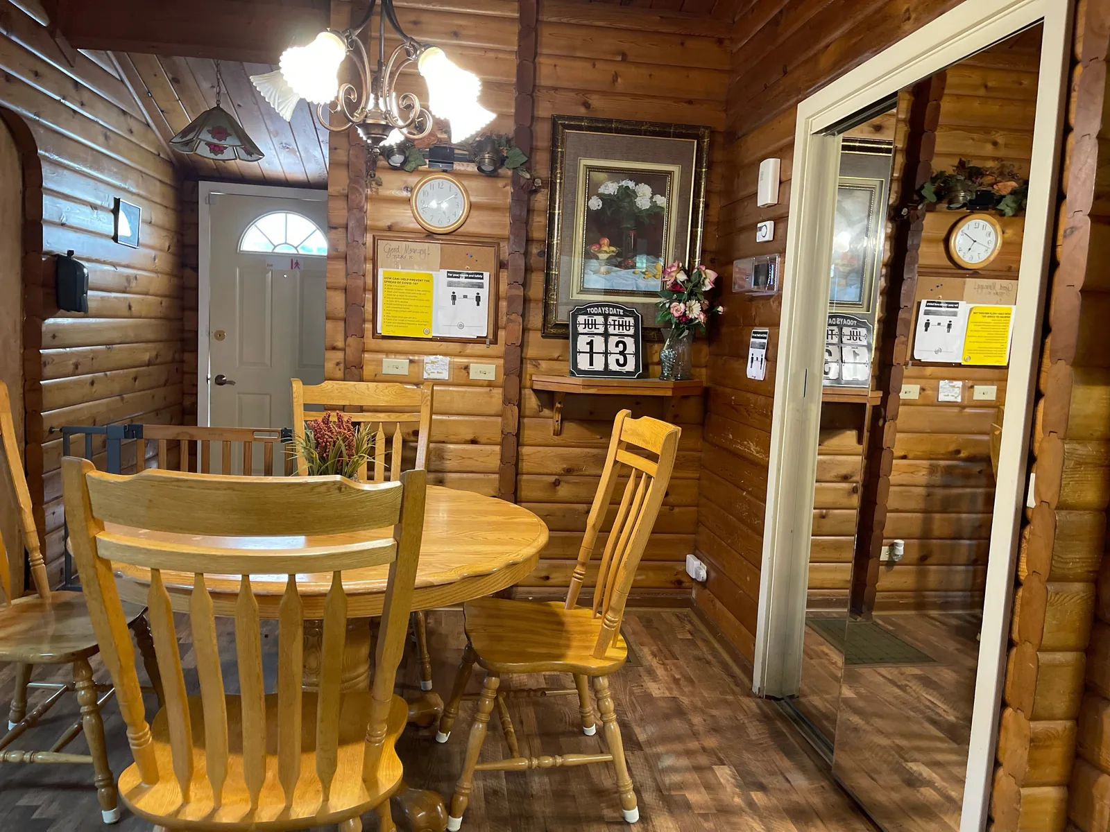 The dining table and log walls inside Birdsong Adult Family Home, Kent WA